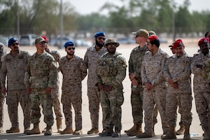 USAF and RSAF service members watch an exercise demonstration