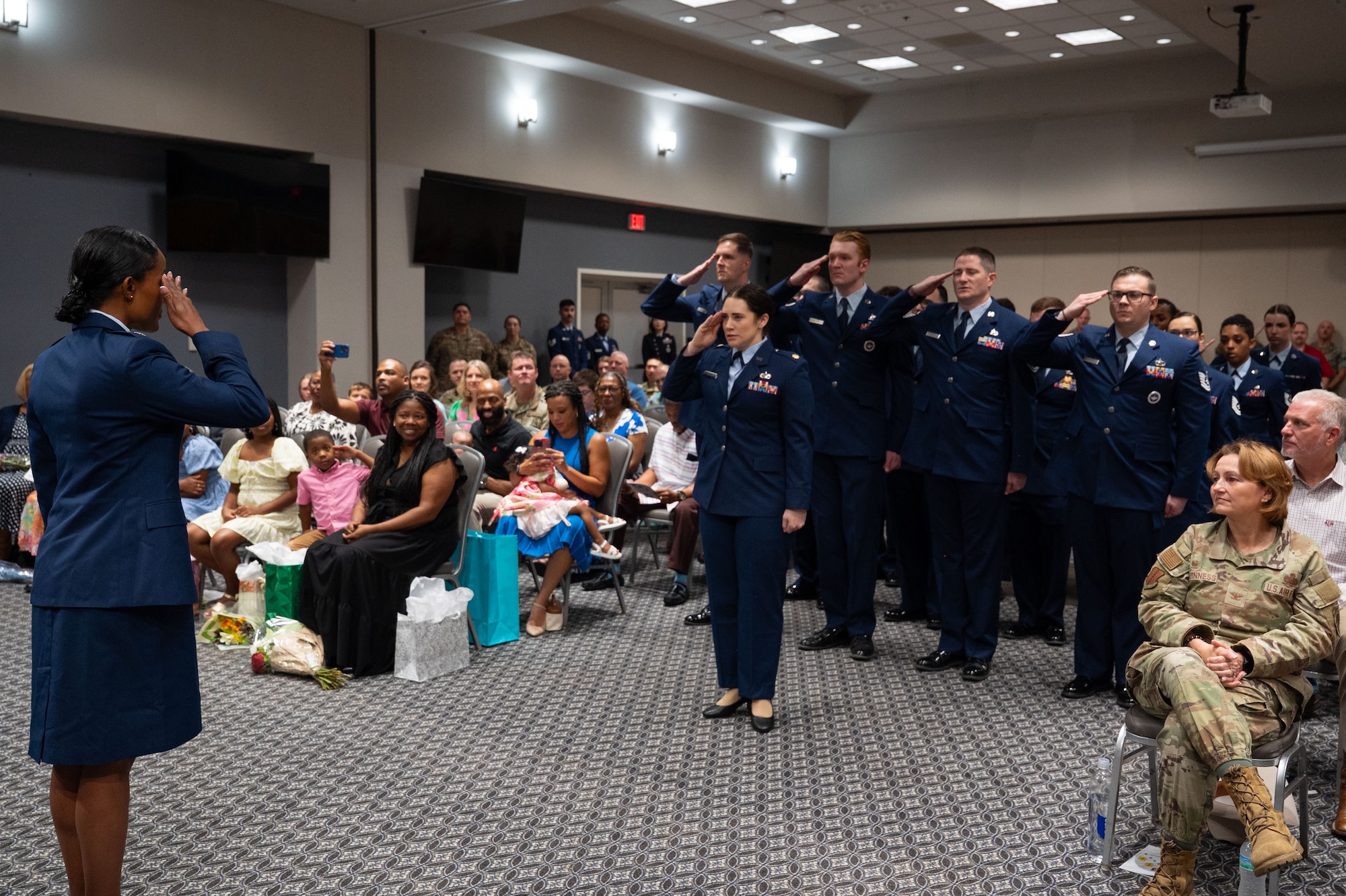 U.S. Air Force Airmen assigned to the 316th Training Squadron present Bryanna McQueen, 316th TRS commander, with her first salute upon taking command at the Powell Event Center, Goodfellow Air Force Base, Texas, July 11, 2025. The 316th TRS is tasked with training, developing and inspiring the next generation of intelligence, surveillance and reconnaissance warriors. (U.S. Air Force Photo by Airman 1st Class Brian Lummus)