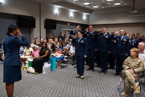 U.S. Air Force Airmen assigned to the 316th Training Squadron present Bryanna McQueen, 316th TRS commander, with her first salute upon taking command at the Powell Event Center, Goodfellow Air Force Base, Texas, July 11, 2025. The 316th TRS is tasked with training, developing and inspiring the next generation of intelligence, surveillance and reconnaissance warriors. (U.S. Air Force Photo by Airman 1st Class Brian Lummus)