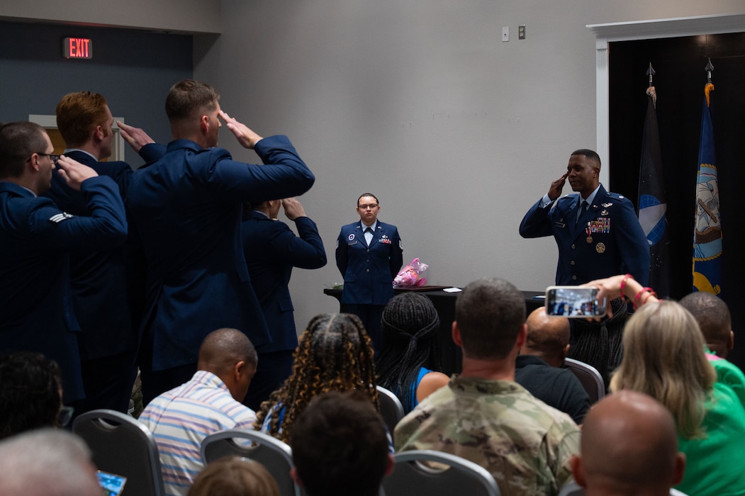 U.S. Air Force Airmen assigned to the 316th Training Squadron present Lt. Col. Jahmil Edwards, outgoing 316th TRS commander, with his final salute upon relinquishing command at the Powell Event Center, Goodfellow Air Force Base, Texas, June 18, 2025. The 316th TRS uses relevant and realistic joint intelligence, surveillance and reconnaissance training to supply the DoD with cryptologic language analysts, signals intelligence analysts and network and fusion analysts. (U.S. Air Force Photo by Airman 1st Class Brian Lummus)
