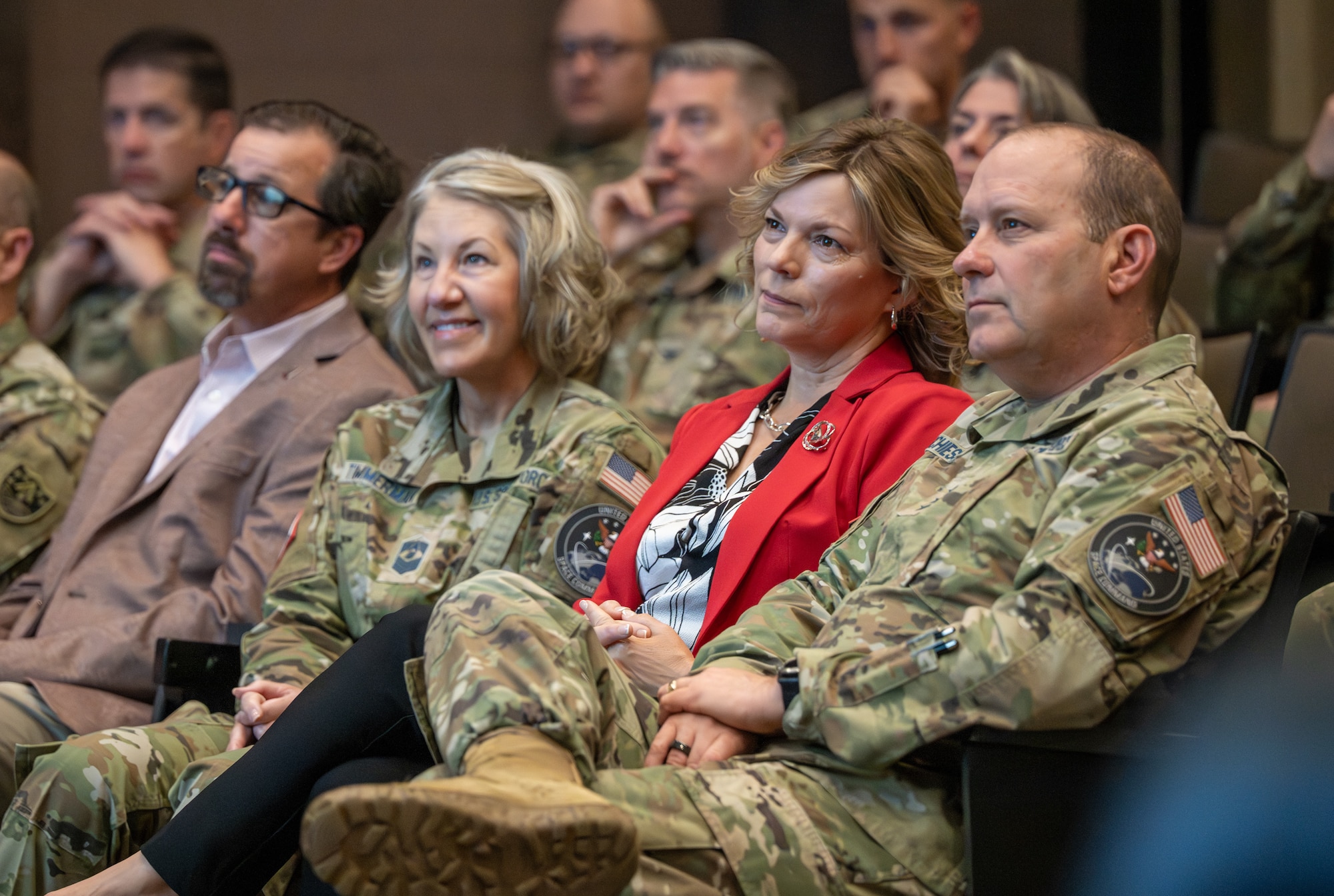 People listen to a speaker during an update session.