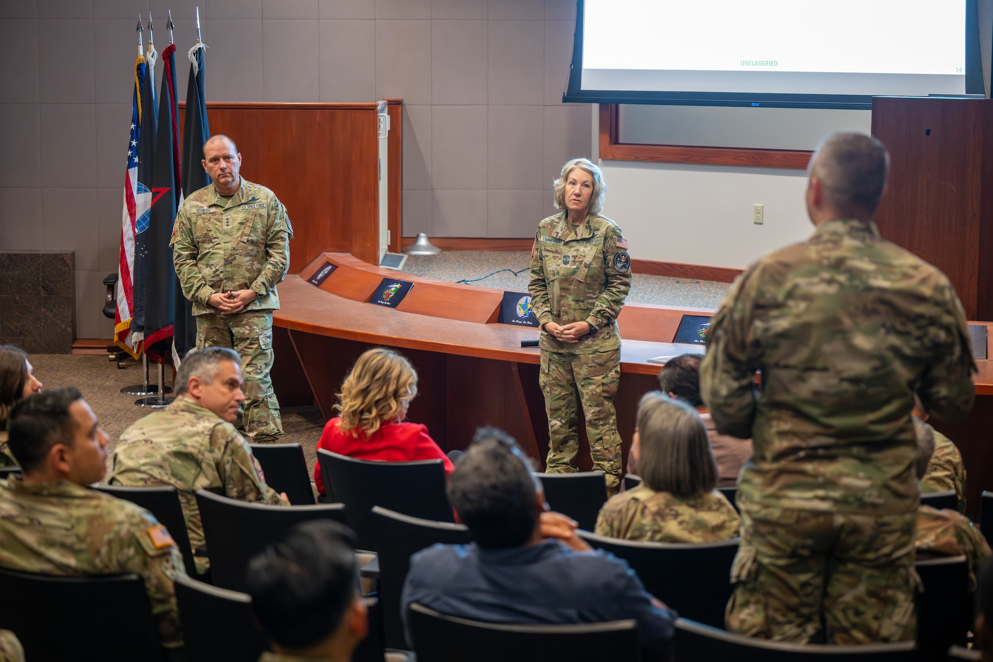 Two senior members of the Space Force answer questions in an auditoriam