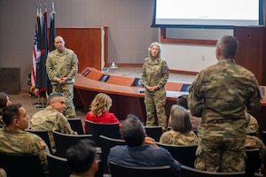 Two senior members of the Space Force answer questions in an auditoriam