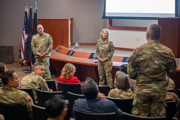 Two senior members of the Space Force answer questions in an auditoriam