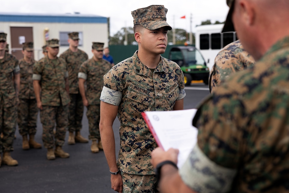 U.S. Marine Corps Cpl. Nicholas Martinez stands at attention during a formation