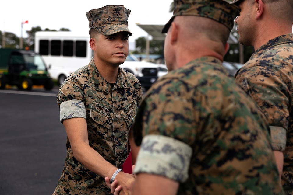 U.S. Marine Corps Cpl. Nicholas Martinez receives a Military Outstanding Volunteer Service Medal