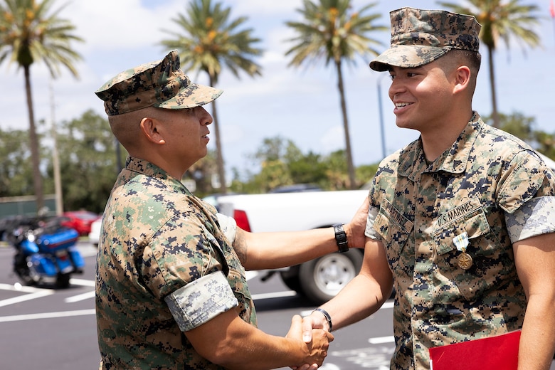 U.S. Marines congratulate Cpl. Nicholas Martinez