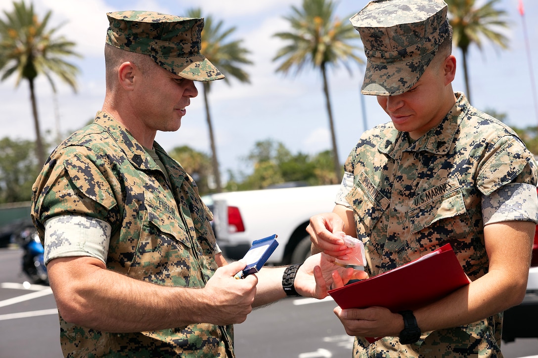 U.S. Marines congratulate Cpl. Nicholas Martinez