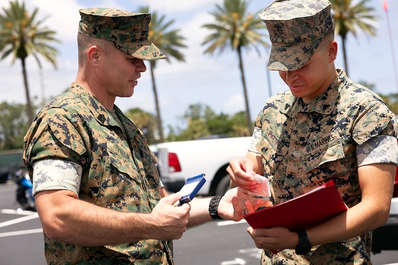 U.S. Marines congratulate Cpl. Nicholas Martinez