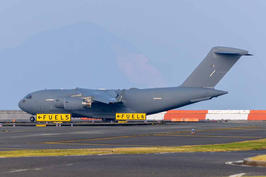 A U.S. Air Force C-17 Globemaster III assigned to the 437th Airlift Wing, Joint Base Charleston, South Carolina, taxis on the flightline after arriving at Marine Corps Air Station Iwakuni as part of exercise Resolute Pacific Force (REFORPAC) 2025, at MCAS Iwakuni, Japan, July 10, 2025. REFORPAC is designed to deliver Air Force capabilities to the Indo-Pacific region at speed and scale, then demonstrate the ability to command and control agile combat employment operations across more than six time zones. (U.S. Marine Corps photo by Cpl. Dahkareo Pritchett)