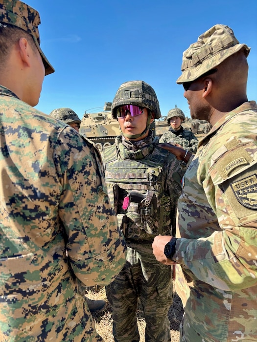 Gen Xavier Brunson, Commander of the United Nations command, Combined Forces Command and U.S Forces Korea talks with a Republic of Korea Marine from the 11th Artillery Battalion, 1st Marine Division during Talisman Sabre at the Shoalwater Bay Training Area in Queensland July 14, 2025.