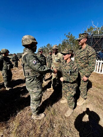 U.S. Marine Corps Maj. Gen. Valerie A. Jackson, commander of U.S. Marine Corps Forces Korea, shakes hands with a Republic of Korea Marine from the 11th Artillery Battalion, 1st Marine Division at the Shoalwater Bay Training Area in Queensland July 14, 2025.