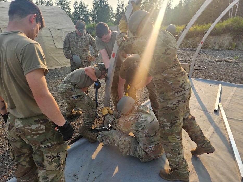 U.S. Air Force 354th Civil Engineering Squadron Airmen construct shelter systems at Joint Base Elmendorf-Richardson, Alaska, June 16, 2025.