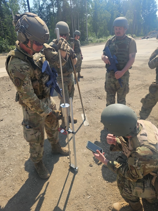 U.S. Air Force 354th Civil Engineering Squadron Airmen perform compaction testing on a finished crater to ensure its strength at Joint Base Elmendorf-Richardson, Alaska, June 19, 2025.
