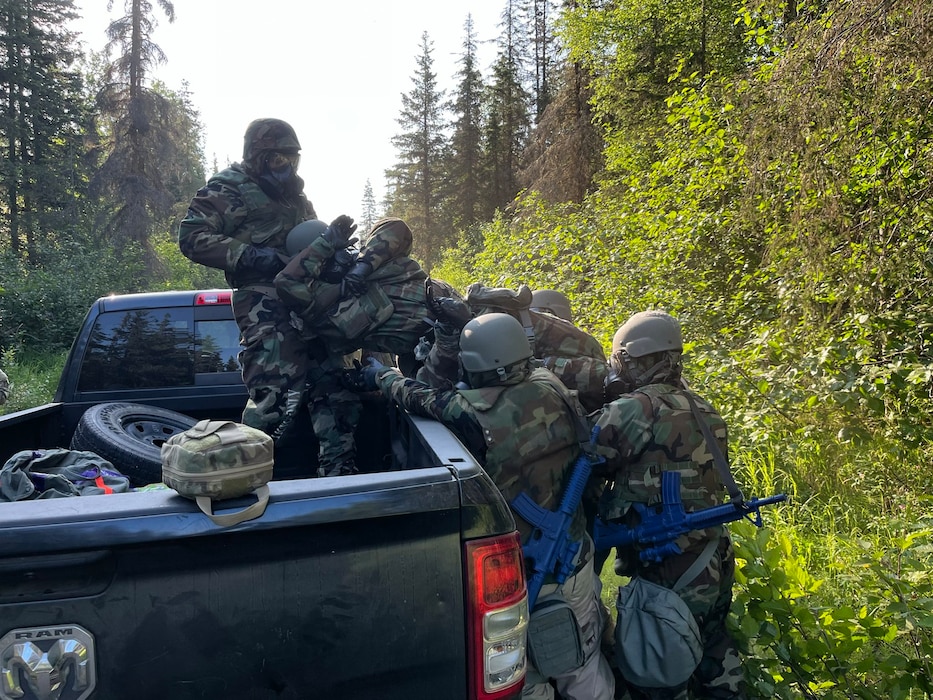 U.S. Air Force 354th Civil Engineering Squadron Airmen simulate an evacuation at Joint Base Elmendorf-Richardson, Alaska, June 19, 2025.