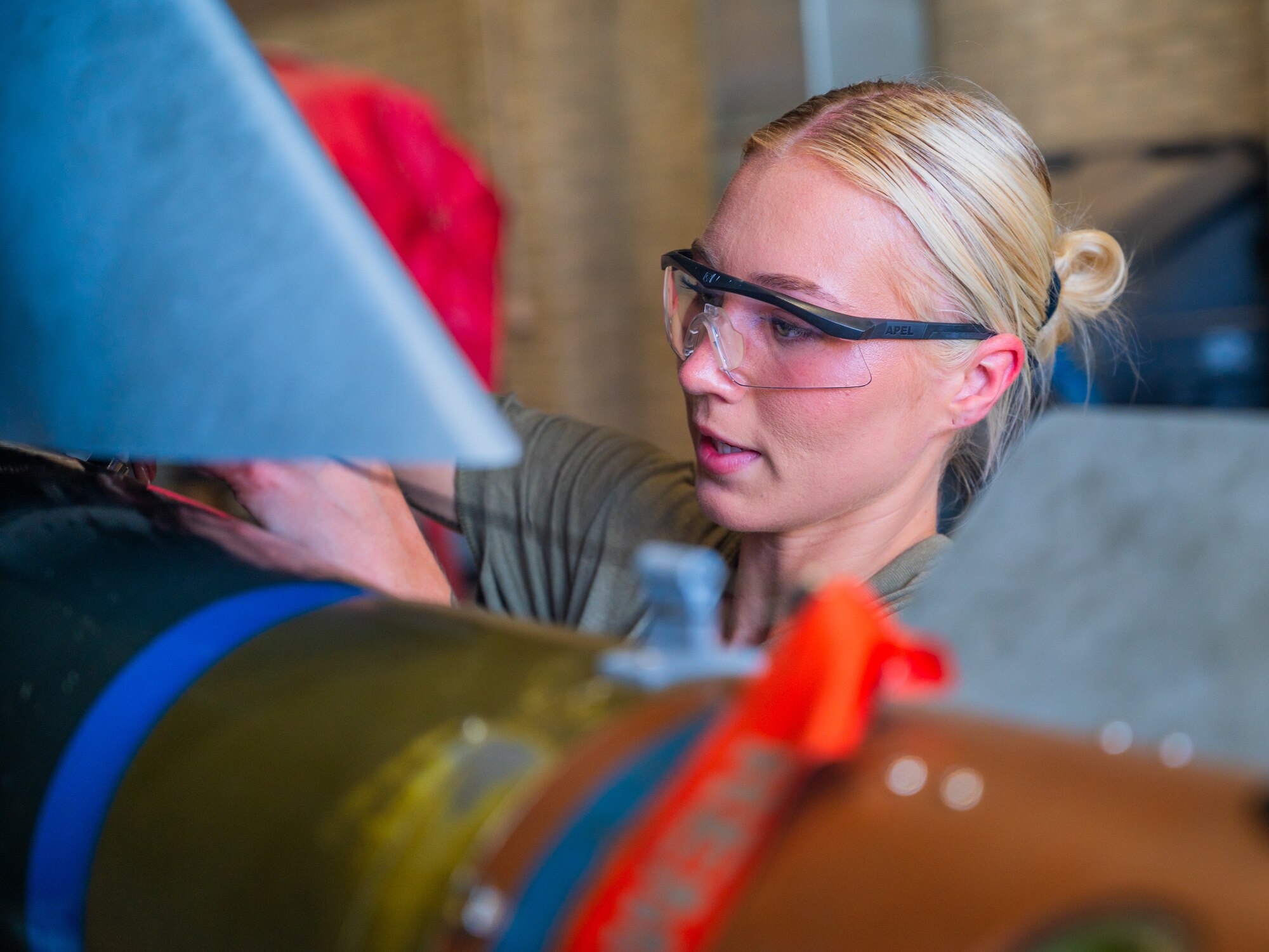 U.S. Air Force Senior Airman Bileigh Malone, 308th Aircraft Maintenance Unit weapons load team member, examines training ordnance during the 56th Fighter Wing’s third quarterly load competition, July 11, 2025, at Luke Air Force Base, Arizona.