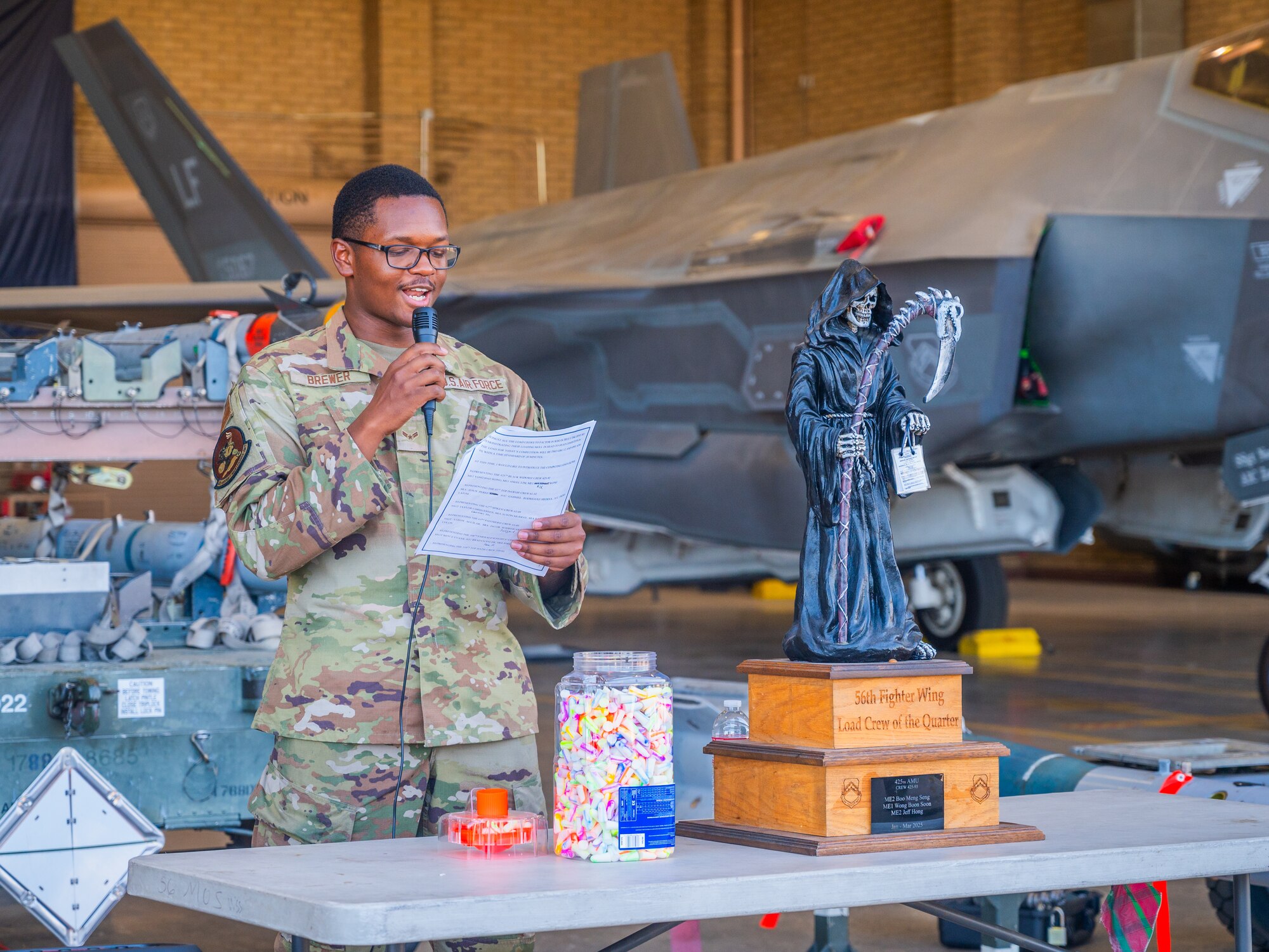 U.S. Air Force Airman 1st Class Dundrae Brewer, 56th Aircraft Maintenance Squadron weapons load crew member, hosts the 56th Fighter Wing’s third quarterly load competition, July 11, 2025, at Luke Air Force Base, Arizona.