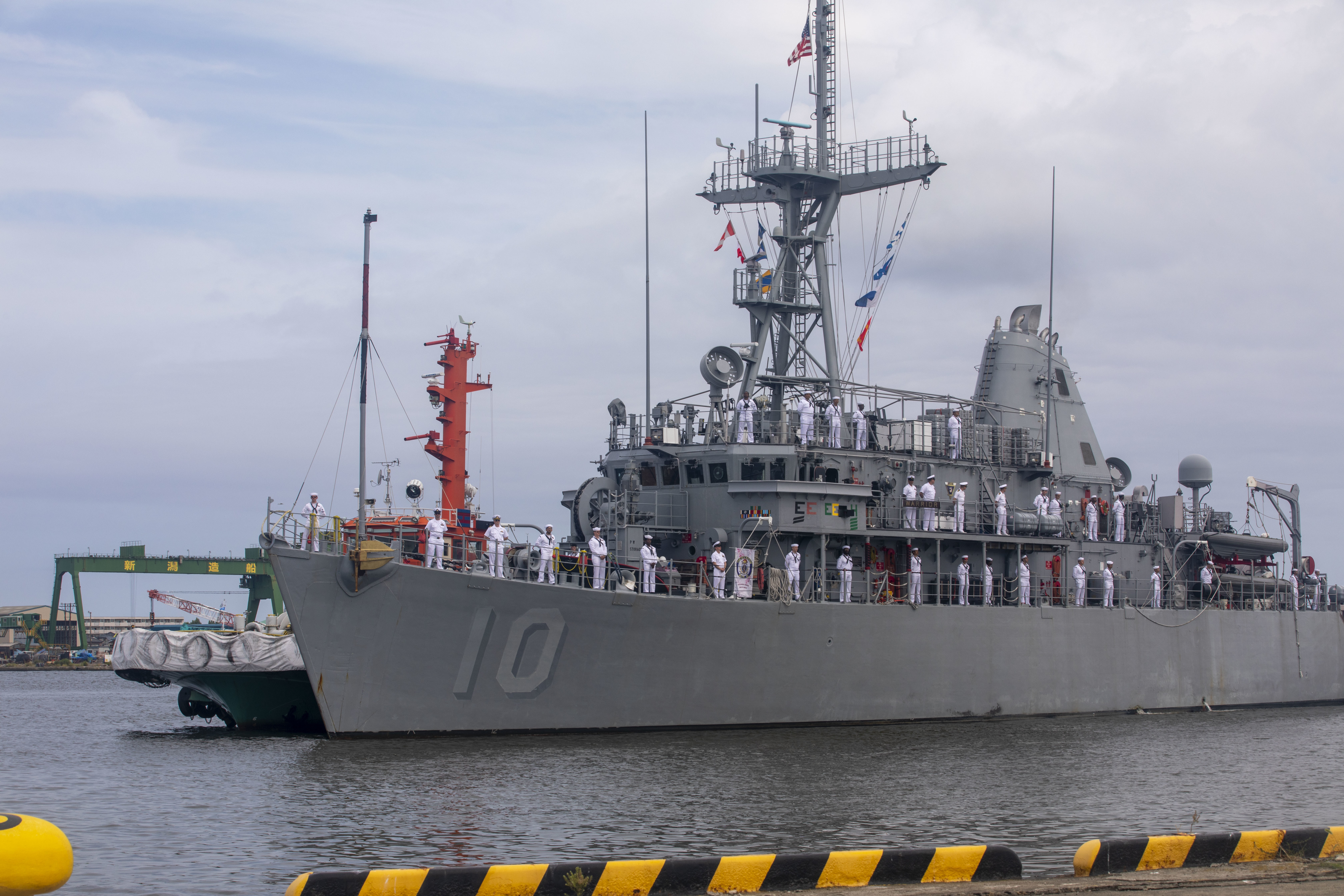 The Avenger-class mine countermeasures ship USS Warrior (MCM 10) arrives in Niigata, Japan for a scheduled port visit, July 12, 2025.
