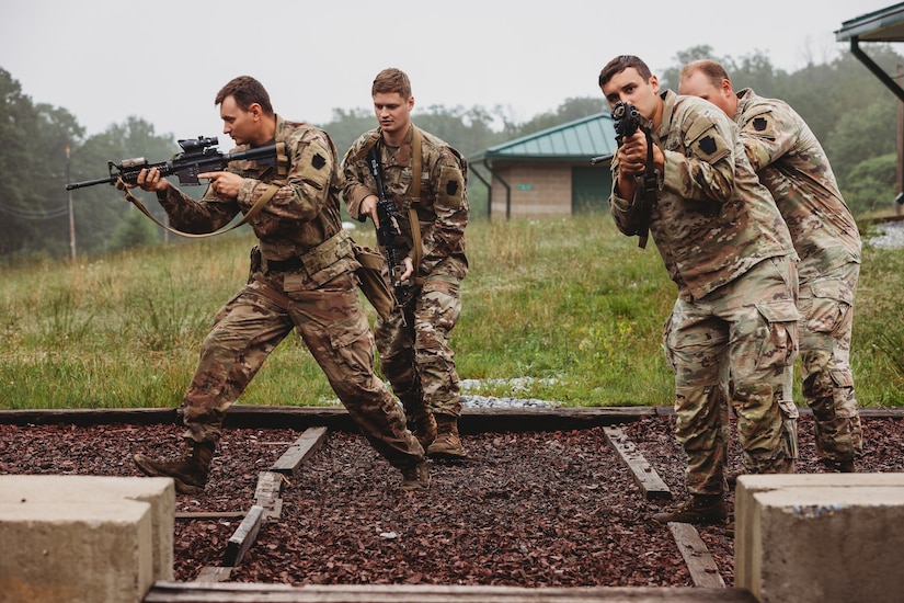 Soldiers with Bravo Company, 1st Battalion, 112th Infantry Regiment, 56th Stryker Brigade Combat Team practice various close quarter battle techniques at the live fire shoot house complex at Fort Indiantown Gap, Pennsylvania, June 10, 2025. The Soldiers conducted several iterations to practice movement while firing live rounds. (U.S. Army National Guard photo by Staff Sgt. Jonathan Campbell)