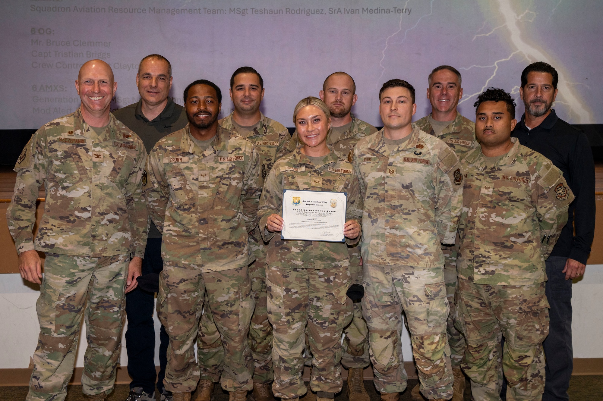 The 6th Security Forces Squadron Plans and Programs team pose for a photo during the First Quarter All-Call Awards Ceremony at MacDill Air Force Base, Florida, May 20, 2025. The unit was recognized for superior performance for their strict enforcement and accountability of all personnel and security levels during the Nuclear Operational Readiness Inspection. (U.S. Air Force photo by Senior Airman Alicia Campbell)