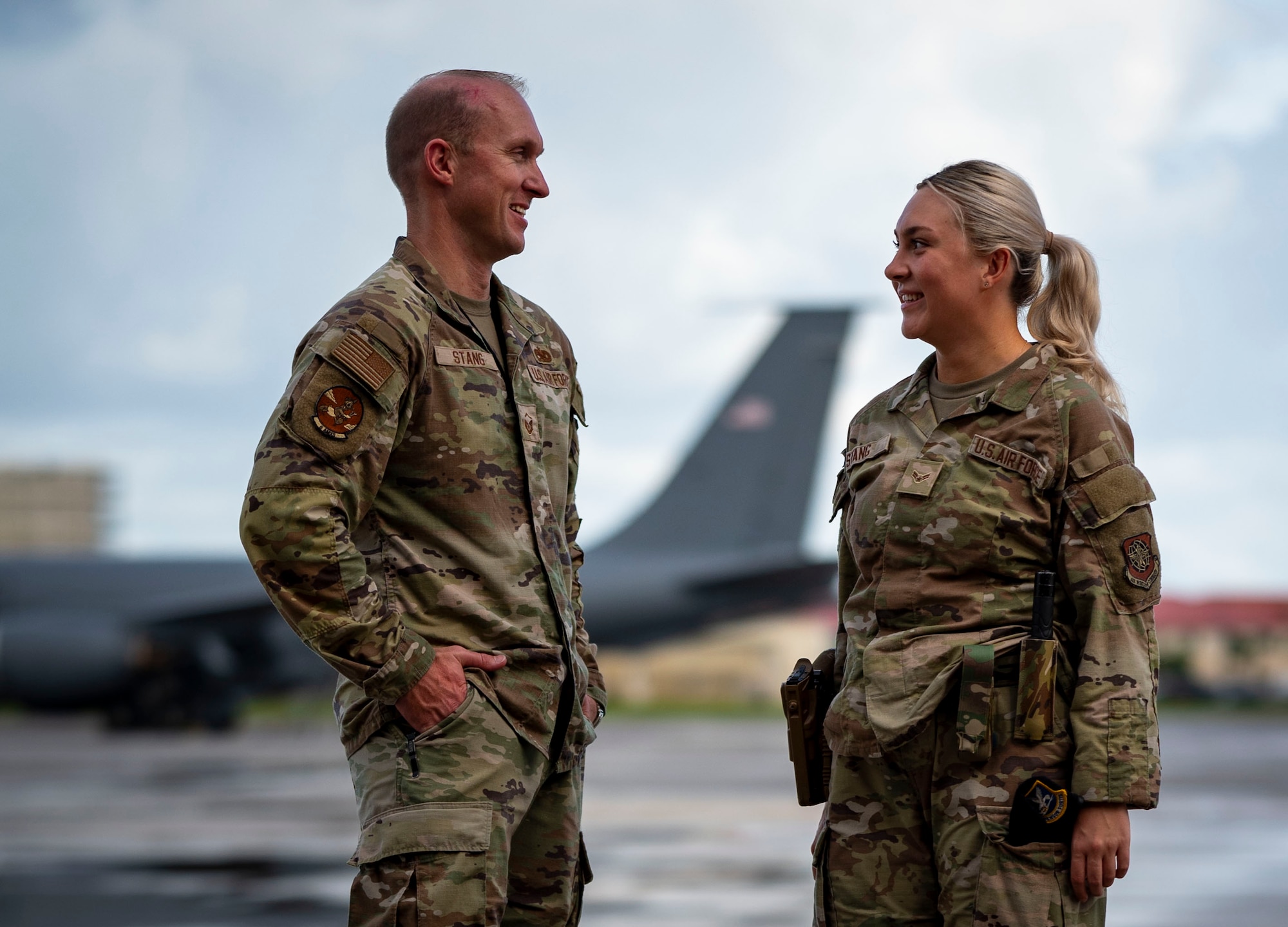 U.S. Air Force Master Sgt. Joseph Stang, left, 6th Aircraft Maintenance Squadron production superintendent, and daughter, Airman 1st Class Isabella Stang, a 6th Security Forces Squadron administration and reports clerk, discuss their day at MacDill Air Force Base, Florida, July 2, 2025. This father and daughter duo have had the rare opportunity to be stationed at the same base at the same time, serving in the 6th Air Refueling Wing’s mission to project air-refueling power worldwide. (U.S. Air Force photo by Senior Airman Alicia Campbell)