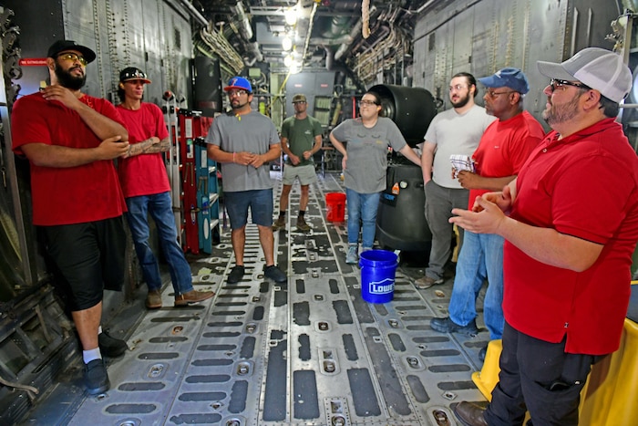 New employees walk inside aircraft