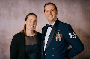 Tech. Sgt. Erik Stauffer, 420th Air Base Squadron noncommissioned officer in charge (NCOIC) of radio frequency transmissions, and his wife, Sophie Stauffer, pose for a photo.
