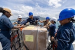 PUERTO PLATA, Dominican Republic (July 15, 2025) Sailors assigned to the Mercy-class hospital ship USNS Comfort (T-AH 20) load medical site cargo aboard Comfort in Puerto Plata, Dominican Republic during Continuing Promise 2025, July 15, 2025. Continuing Promise 2025 is the 16th iteration of the U.S. 4th Fleet/U.S. Naval Forces Southern Command-led Mission since 2007, which aims to foster goodwill, strengthen existing partnerships with partner nations, and form new partnerships between host nations, non-federal entities, and international organizations. (U.S. Navy photo by Mass Communication Specialist 2nd Class Alfredo Marron)