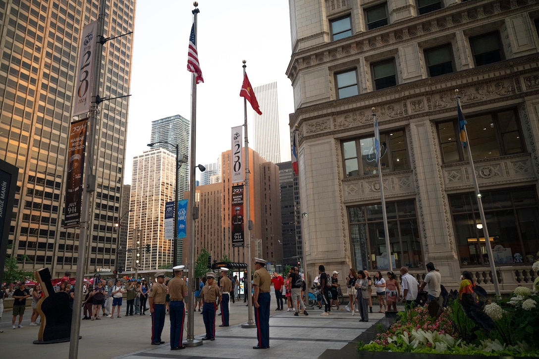 U.S. Marines with the 2nd Battalion, 24th Marine Regiment, 4th Marine Division color guard, assigned to Special Purpose Marine Air-Ground Task Force-250, conduct the final  evening colors ceremony at the Plaza of the Americas during Marine Week Chicago, July 13, 2025. This year, the Marine Corps will celebrate two and a half centuries of serving the Nation with honor, courage, and commitment. (U.S. Marine Corps photo by Sgt. Kayla Halloran)
