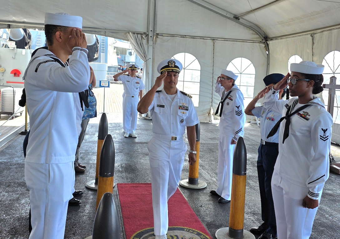Incoming and outgoing commander walks into ceremony.