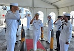 Incoming and outgoing commander walks into ceremony.