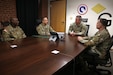 1st Lt. Juan Santiago (second from the left), financial officer, 1st Theater Sustainment Command, briefs his team in the G8 section, Fort Knox, Kentucky.