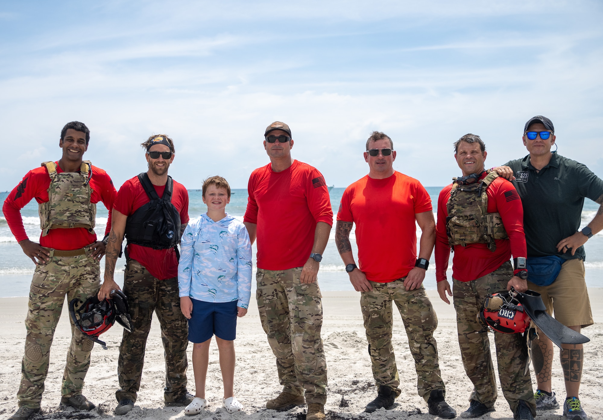 Jackson Posch stands with pararescuemen from the 920th Rescue Wing during the Cocoa Beach Air Show, July 12, 2025. From left: Master Sgt. Ricky Dunn, Tech. Sgt. Creighton Trott, Senior Master Sgt. Matt Williams, Lt. Col. Jim Sluder, and Capt. Rory Whipple. The team served alongside Jackson’s father, Master Sgt. William Posch, and continue to honor his legacy by mentoring Jackson as one of their own.