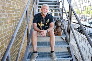 Todd Mitchell, an electronics technician at 582nd Missile Maintenance Squadron, with his Jim Morrison bust June 13, 2025, at Hill Air Force Base, Utah. (U.S. Air Force photo by Cynthia Griggs)