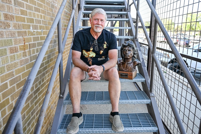 Todd Mitchell, an electronics technician at 582nd Missile Maintenance Squadron, with his Jim Morrison bust June 13, 2025, at Hill Air Force Base, Utah. (U.S. Air Force photo by Cynthia Griggs)