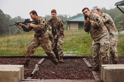 Soldiers with Bravo Company, 1st Battalion, 112th Infantry Regiment, 56th Stryker Brigade Combat Team practice various close quarter battle techniques at the live fire shoot house complex at Fort Indiantown Gap, Pennsylvania, June 10, 2025. The Soldiers conducted several iterations to practice movement while firing live rounds. (U.S. Army National Guard photo by Staff Sgt. Jonathan Campbell)