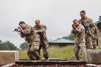 Soldiers with Bravo Company, 1st Battalion, 112th Infantry Regiment, 56th Stryker Brigade Combat Team practice various close quarter battle techniques at the live fire shoot house complex at Fort Indiantown Gap, Pennsylvania, June 10, 2025. The Soldiers conducted several iterations to practice movement while firing live rounds. (U.S. Army National Guard photo by Staff Sgt. Jonathan Campbell)