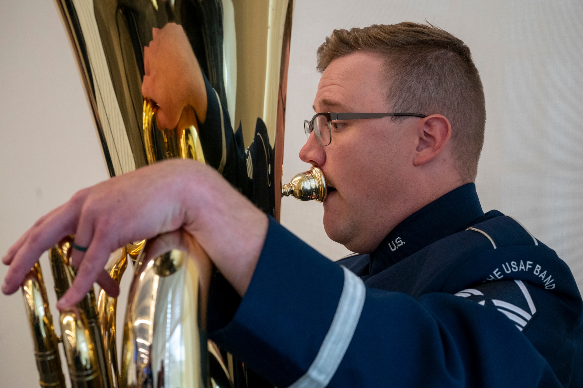 U.S. Air Force Master Sgt. Ben Malmer, a tuba player with The U.S. Air Force Band’s Ceremonial Brass, performs during an enlistment ceremony at the Air & Space Forces Association headquarters in Arlington, Va., July 11, 2025. The Ceremonial Brass performed at the ceremony to support their mission of honoring those who have served, inspiring American citizens to heightened patriotism and service, and connecting with the global community on behalf of the U.S. Air Force, U.S. Space Force and the United States. (U.S. Air Force photo by Hayden Hallman)