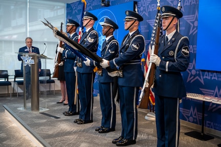 Members of the U.S. Air Force Honor Guard present the colors during the singing of “The Star-Spangled Banner” during an enlistment ceremony at the Air & Space Forces Association headquarters in Arlington, Va., July 11, 2025. The Honor Guard presented the colors to support their mission of delivering premier ceremonial honors, inspiring the nation and representing all Airmen and Guardians to the world. (U.S. Air Force photo by Hayden Hallman)