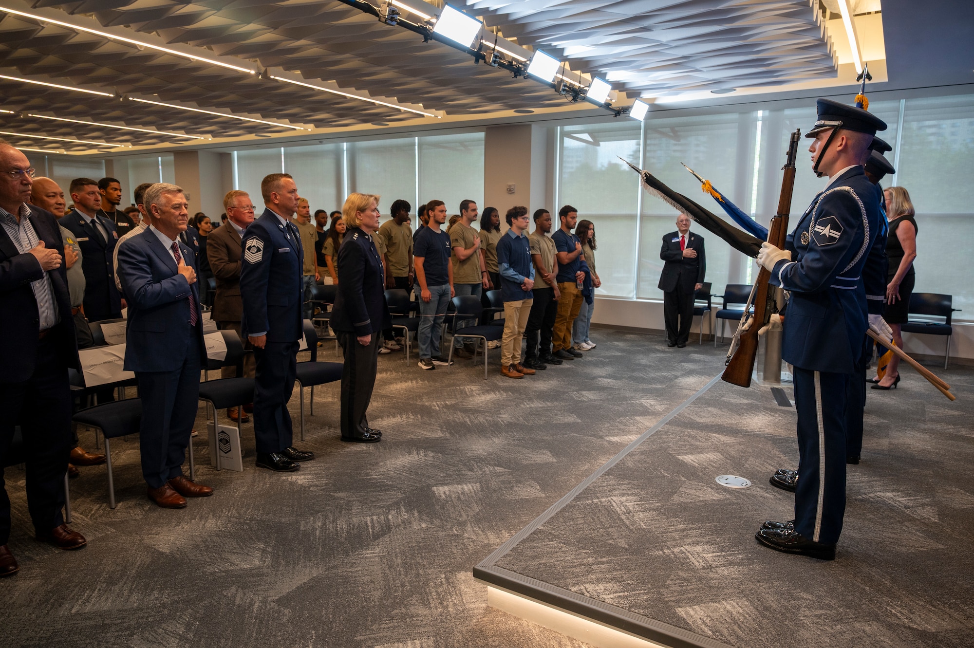 Members of the U.S. Air Force Honor Guard present the colors during the singing of “The Star-Spangled Banner” during an enlistment ceremony at the Air & Space Forces Association headquarters in Arlington, Va., July 11, 2025. The Honor Guard presented the colors to support their mission of delivering premier ceremonial honors, inspiring the nation and representing all Airmen and Guardians to the world. (U.S. Air Force photo by Hayden Hallman)