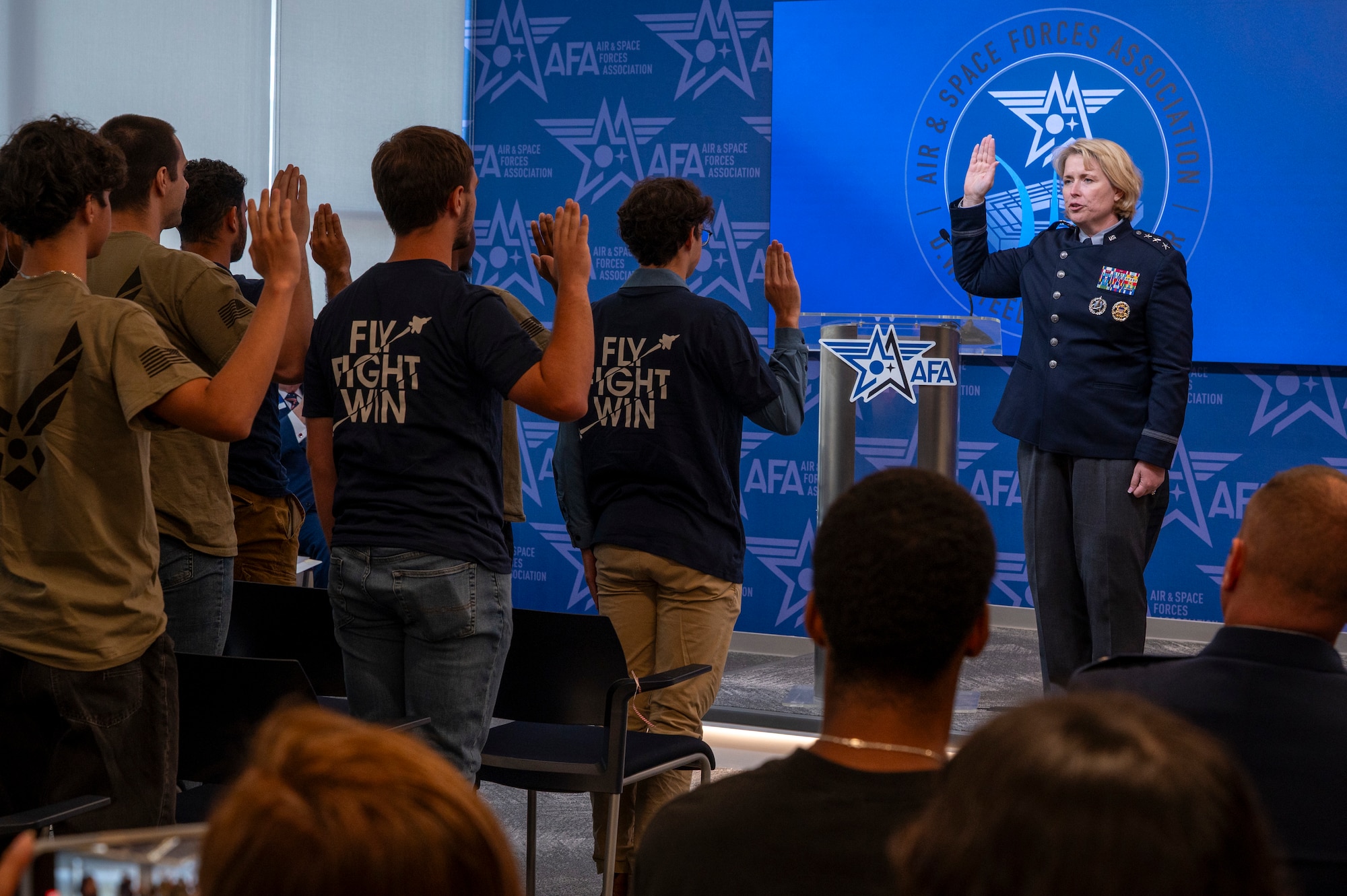 U.S. Space Force Lt. Gen. DeAnna M. Burt, Deputy Chief of Space Operations for Operations, Cyber, and Nuclear, administers the oath of enlistment to delayed entry program recruits during an enlistment ceremony at the Air & Space Forces Association headquarters in Arlington, Va., July 11, 2025. Burt administrated the oath of enlistment as a requirement for entry into the U.S. military as an enlisted member (U.S. Air Force photo by Hayden Hallman)