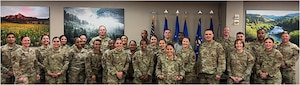 Airmen from the 168th Force Support Squadron, along with other Air National Guard and Reserve Airmen, pose for a group photo while participating in a two-day seminar at Headquarters Air Reserve Personnel Center.