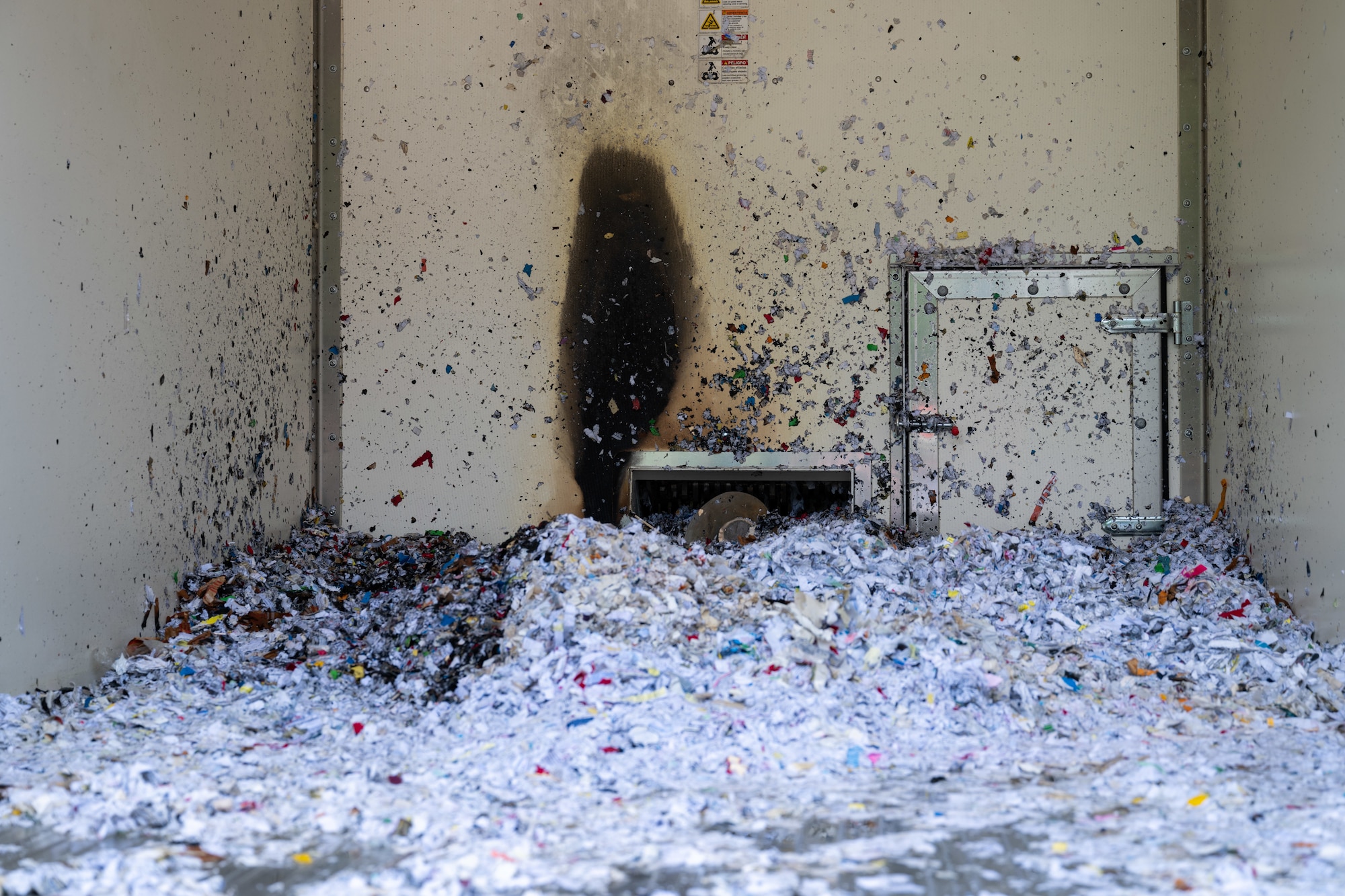 This photo shows the aftermath of a July 11, 2025, fire inside a truck that visits Arnold Air Force Base, Tenn., to shred paper collected across the installation. The truck caught fire during a stop at the Arnold AFB Medical Aid Station. Amanda Van Pelt, Suzanne Hale and Kelsey Rob, who are staffed at the Medical Aid Station by CORE Occupational Medicine, a company subcontracted by the Arnold Engineering Development Complex Test Operations and Sustainment Contractor to provide basic medical services to TOS employees at Arnold AFB, headquarters of AEDC. The CORE team sprang into action when a truck collecting shredded materials unexpectedly caught fire. They used extinguishers to quickly put out the flames, preventing the fire from spreading and minimizing damage. (U.S. Air Force photo by Keith Thornburgh)