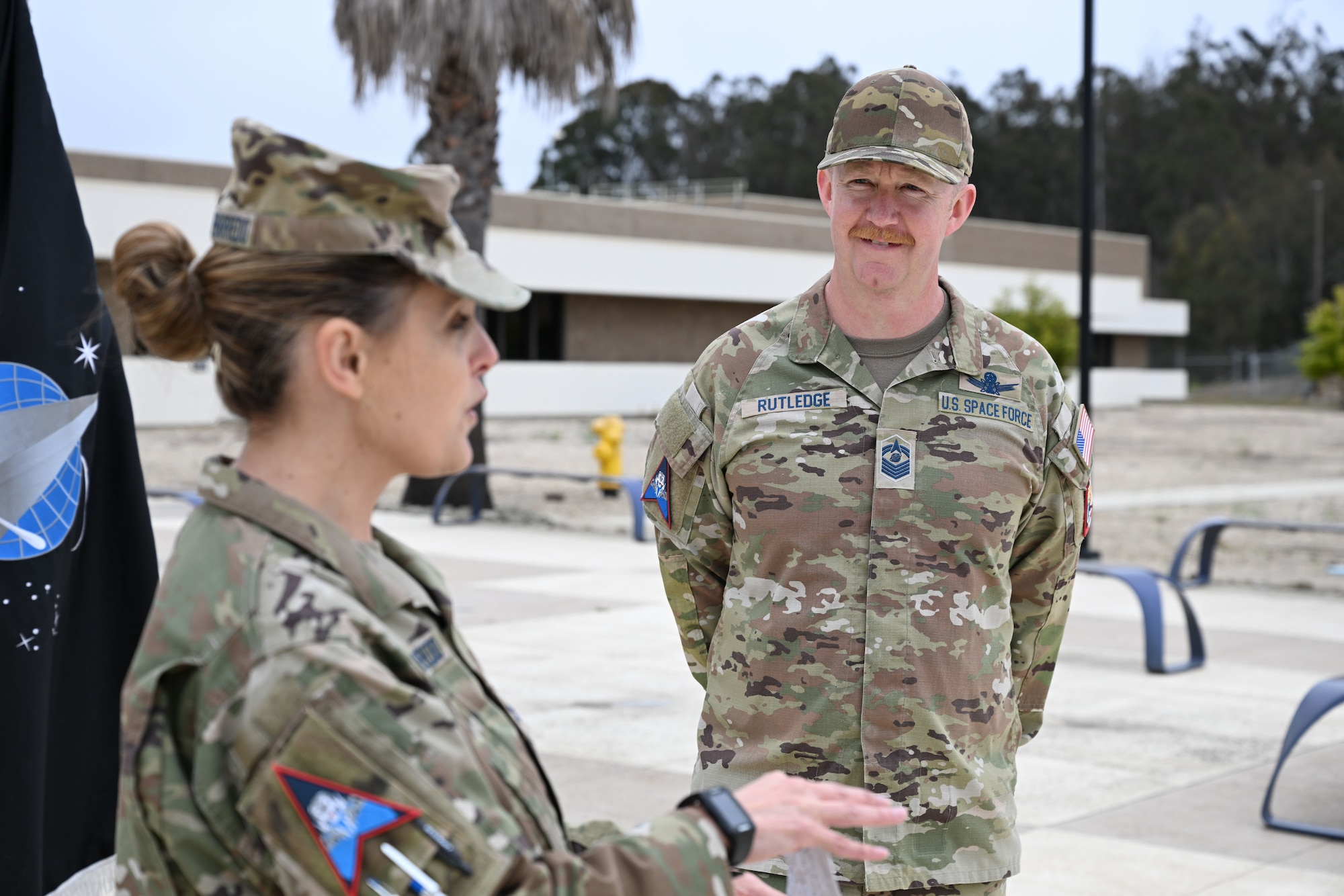 A Space Force officer administers an oath to a service member.