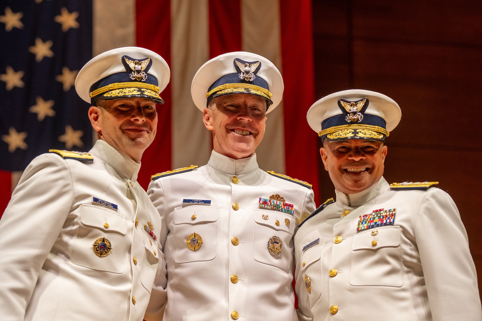 U.S. Coast Guard Academy (USCGA) Superintendent Rear Adm. Gregory Rothrock (left to right), Acting Commandant of the Coast Guard Adm. Kevin Lunday, and Rear Adm. Michael Johnston pose for a photo during a change of command ceremony inside Leamy Hall at USCGA, New London, Connecticut, July 16, 2025. Rothrock relieved Johnston and became USCGA’s 44th superintendent. (U.S. Coast Guard photo by Petty Officer Third Class Leo Avila.)