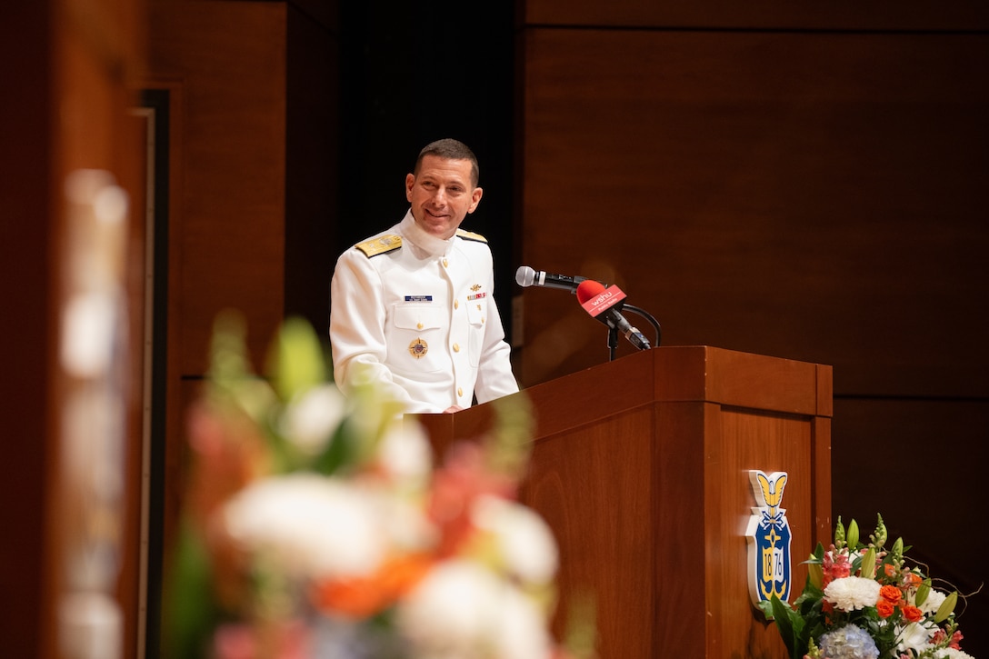 U.S. Coast Guard Academy Superintendent Rear Adm. Gregory Rothrock gives a speech during a change of command ceremony inside Leamy Hall at the U.S. Coast Guard Academy (USCGA), New London, Connecticut, July 16, 2025. Rothrock relieved Rear Adm. Michael Johnston to become the 44th superintendent of USCGA. (U.S. Coast Guard photo by Petty Officer Third Class Leo Avila.)