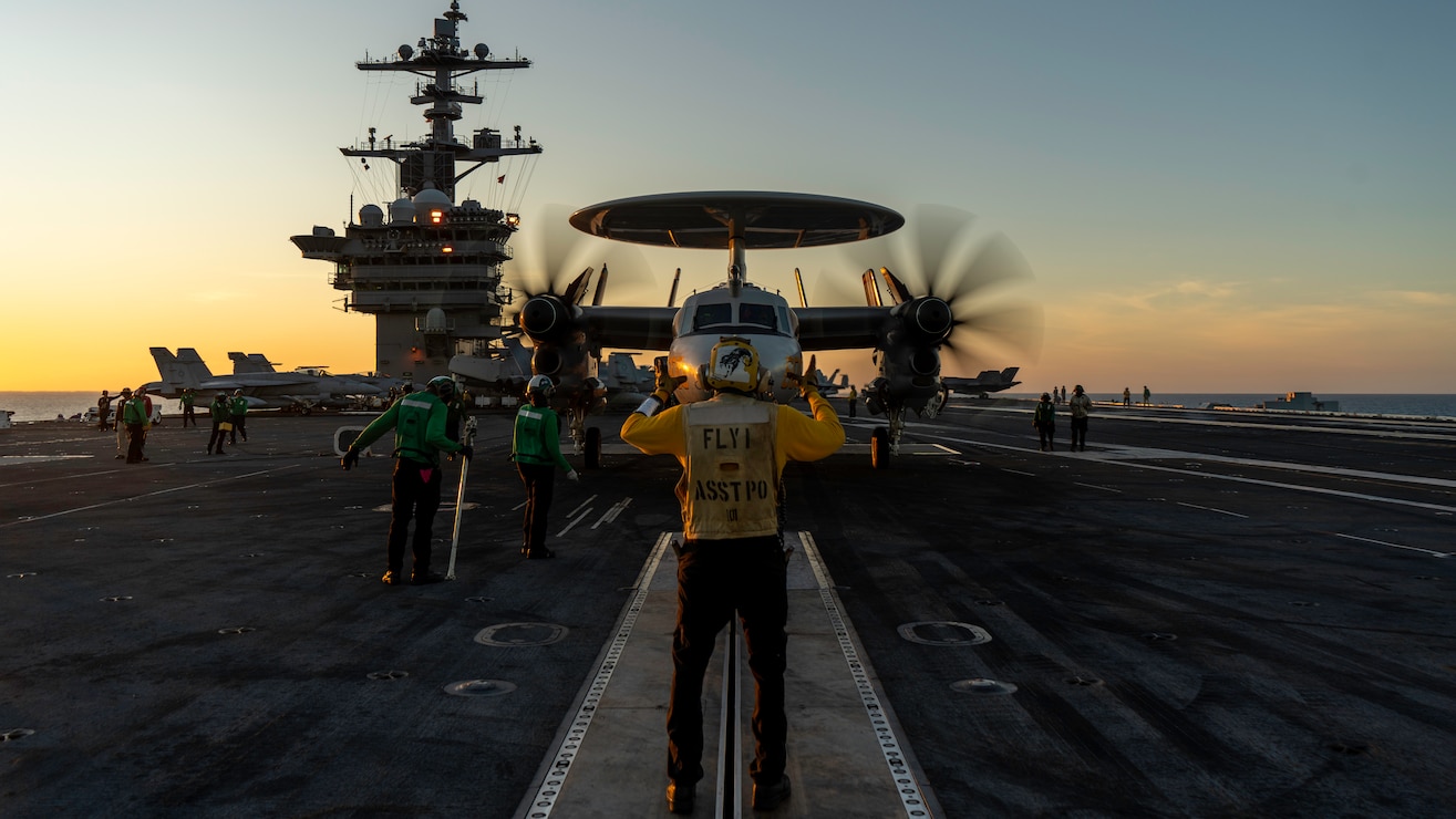 An E-2D Hawkeye, attached to Carrier Airborne Early Warning Squadron (VAW) 125, prepares to take off from the flight deck of the Nimitz-class aircraft carrier USS George Washington (CVN 73) while underway in the Timor Sea in support of Talisman Sabre 2025, July 14. Talisman Sabre is the largest bilateral military exercise between Australia and the United States advancing a free and open Indo-Pacific by strengthening relationships and interoperability among key allies and partners, while enhancing our collective capabilities to respond to a wide array of potential security concerns. (U.S. Navy photo by Mass Communication Specialist 2nd Class Tyler Crowley)