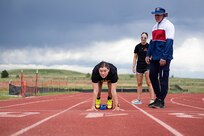 U.S. Army Sgt. Bianca Hayden sets against a starting block for fitting at track practice during the 2025 Department of Defense Warrior Games  at Fort Carson, Colorado, July 14, 2025.