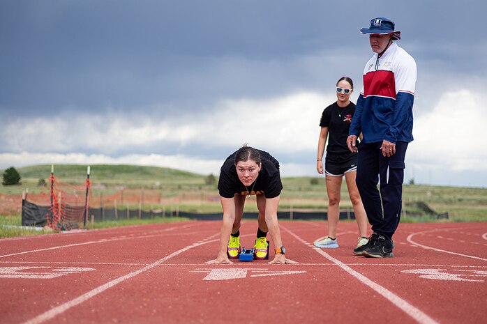 U.S. Army Sgt. Bianca Hayden sets against a starting block for fitting at track practice during the 2025 Department of Defense Warrior Games  at Fort Carson, Colorado, July 14, 2025.