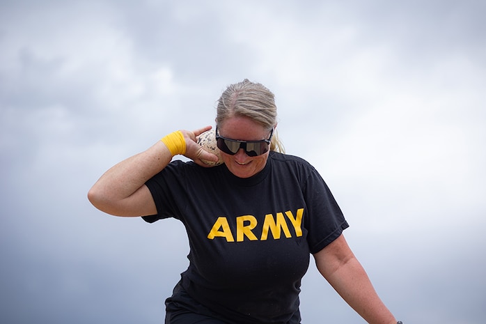 U.S. Army Maj. Amanda Feindt prepares to wind up and putt a shot during field practice during the 2025 Department of Defense Warrior Games  at Fort Carson, Colorado, July 14, 2025.